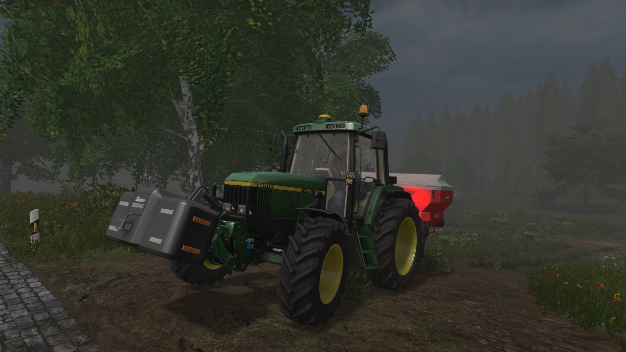 John Deere 6910 am Düngerstreuen