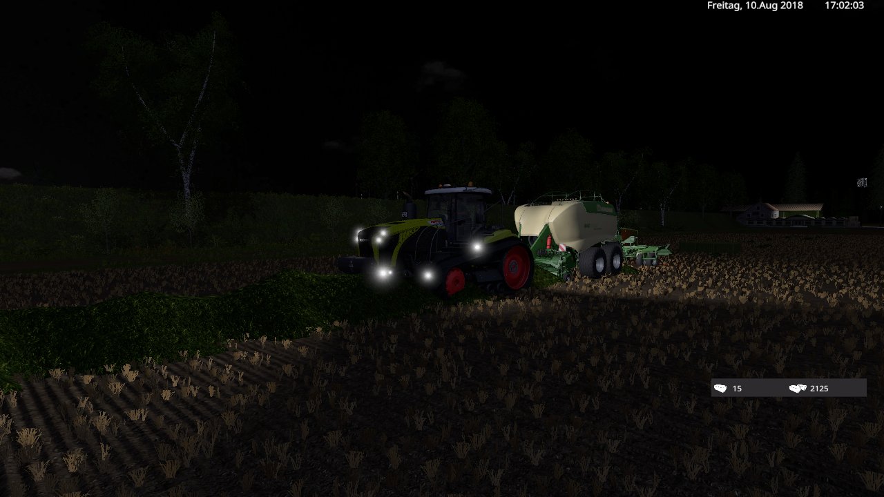 mit der claas raube und krone presse am feld