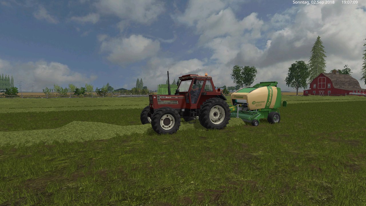 mit den fiat  und krone f155  rundballen presse auf den feld