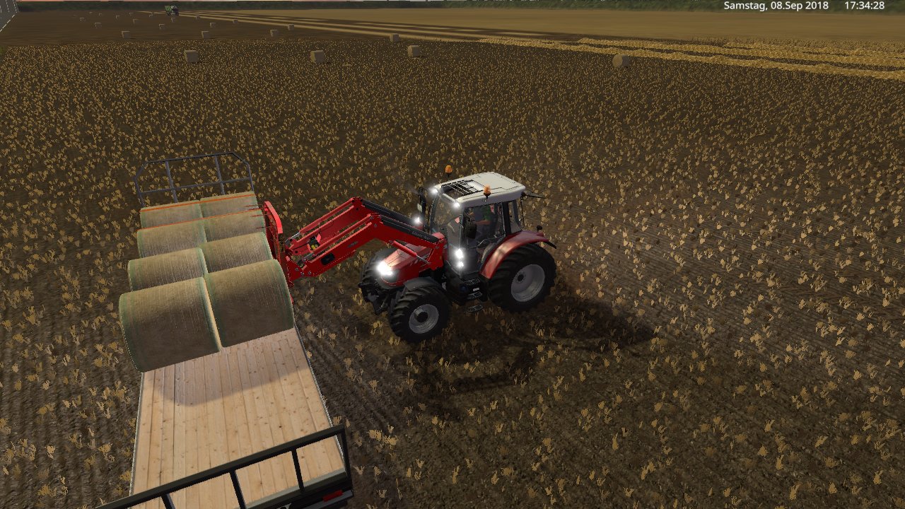 heute mit den massey ferguson 5600 und den fligel ballen wagen stroh holen