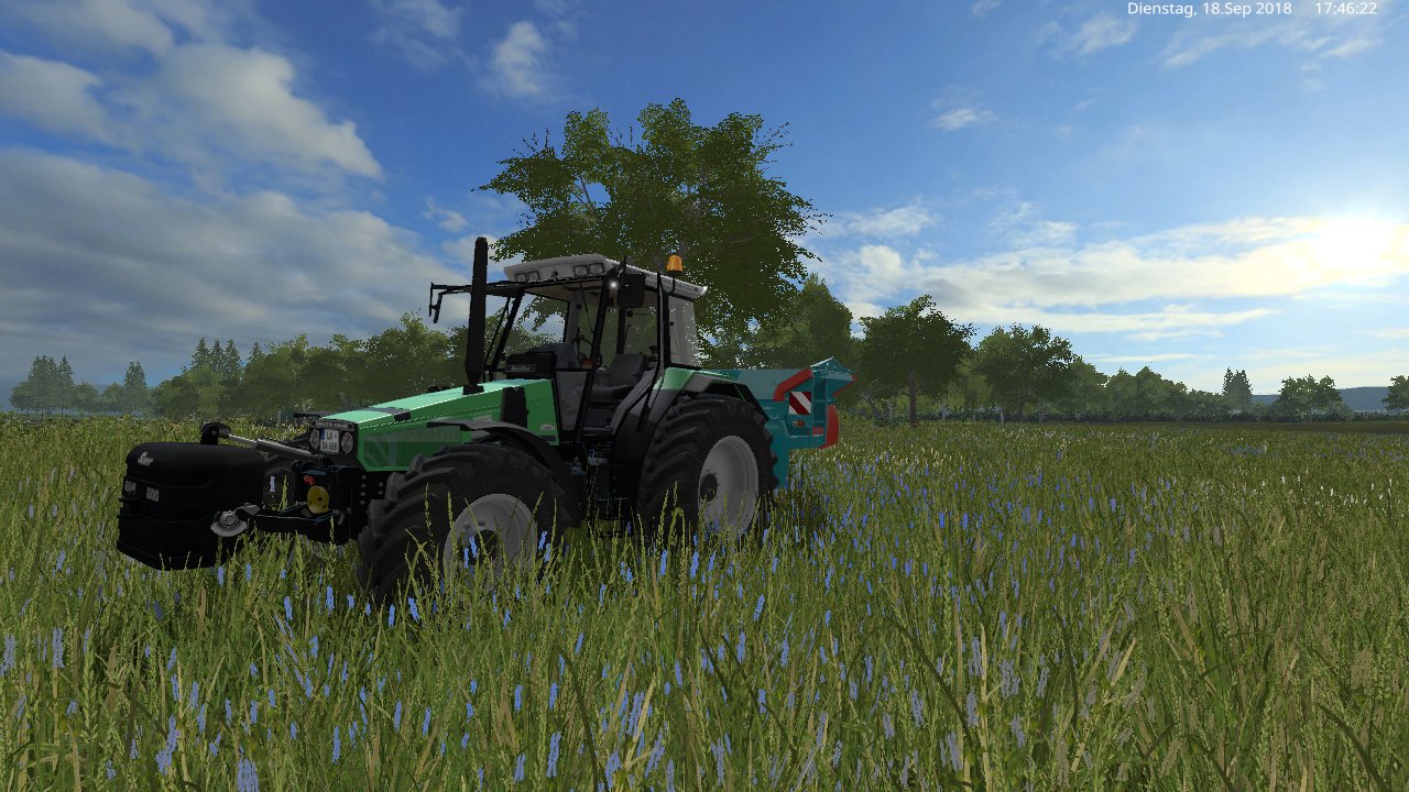 mit den deutz agrostar und den dünger streuer lizard auf der wiese