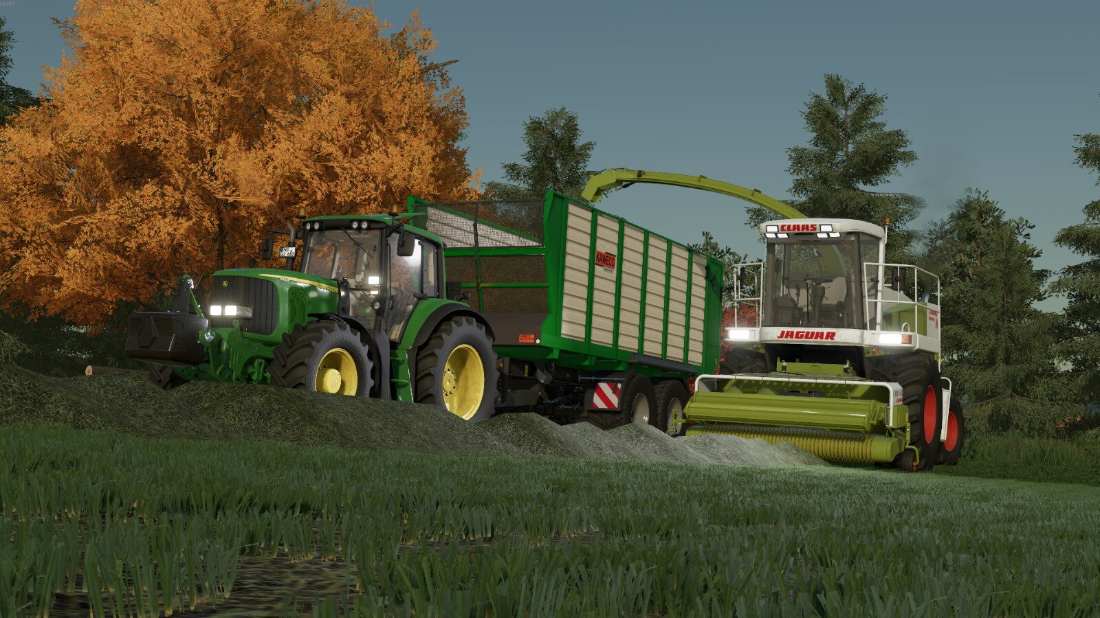 Jaguar 880 mit JD 6820 im Gras